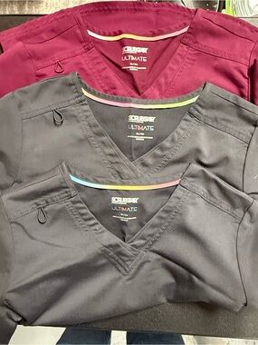 Scrub tops (3) and scrub pants (1)